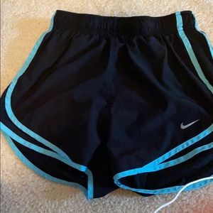 Black and blue Nike running shorts